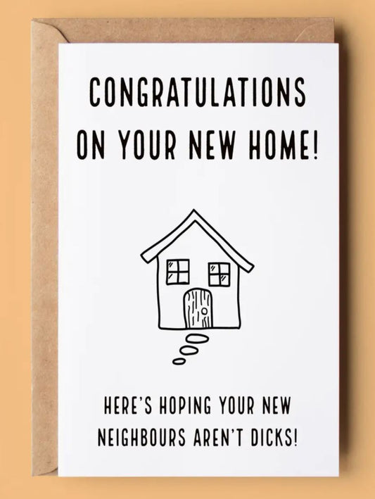 This is a white card with black typography, it has an illustration of a house and says 'here's hoping your new neighbours aren't dicks!'