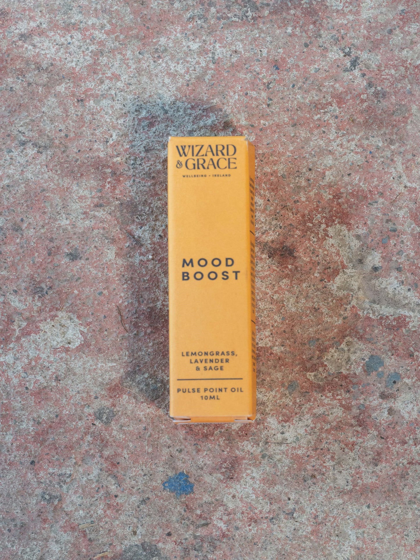 Yellow box labeled 'Wizard & Grace Mood Boost' on a textured surface