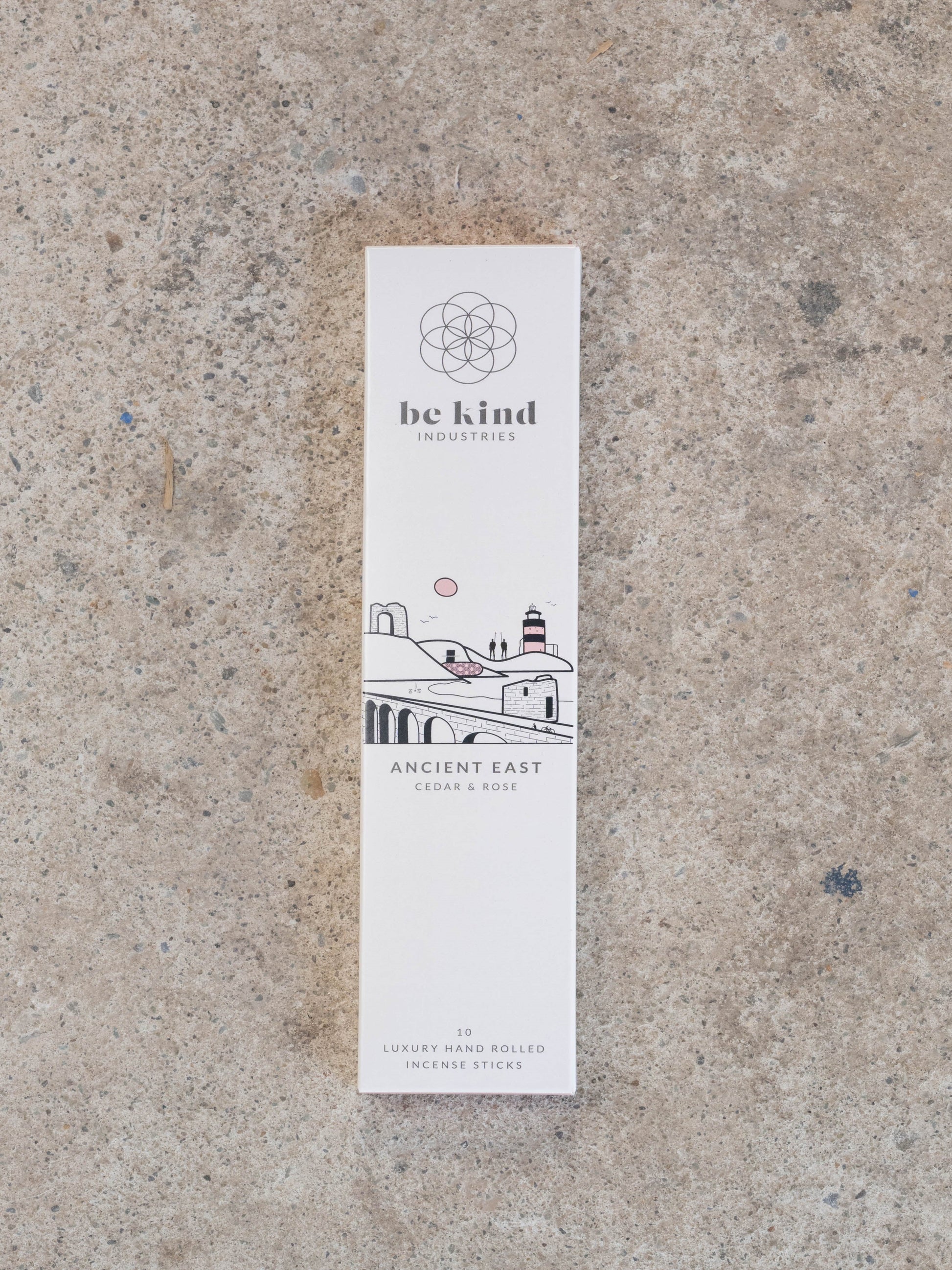 Be kind Industries Ancient East incense stick packaging on a textured surface. These are Cedar and Rose and contain ten hand rolled incense sticks.