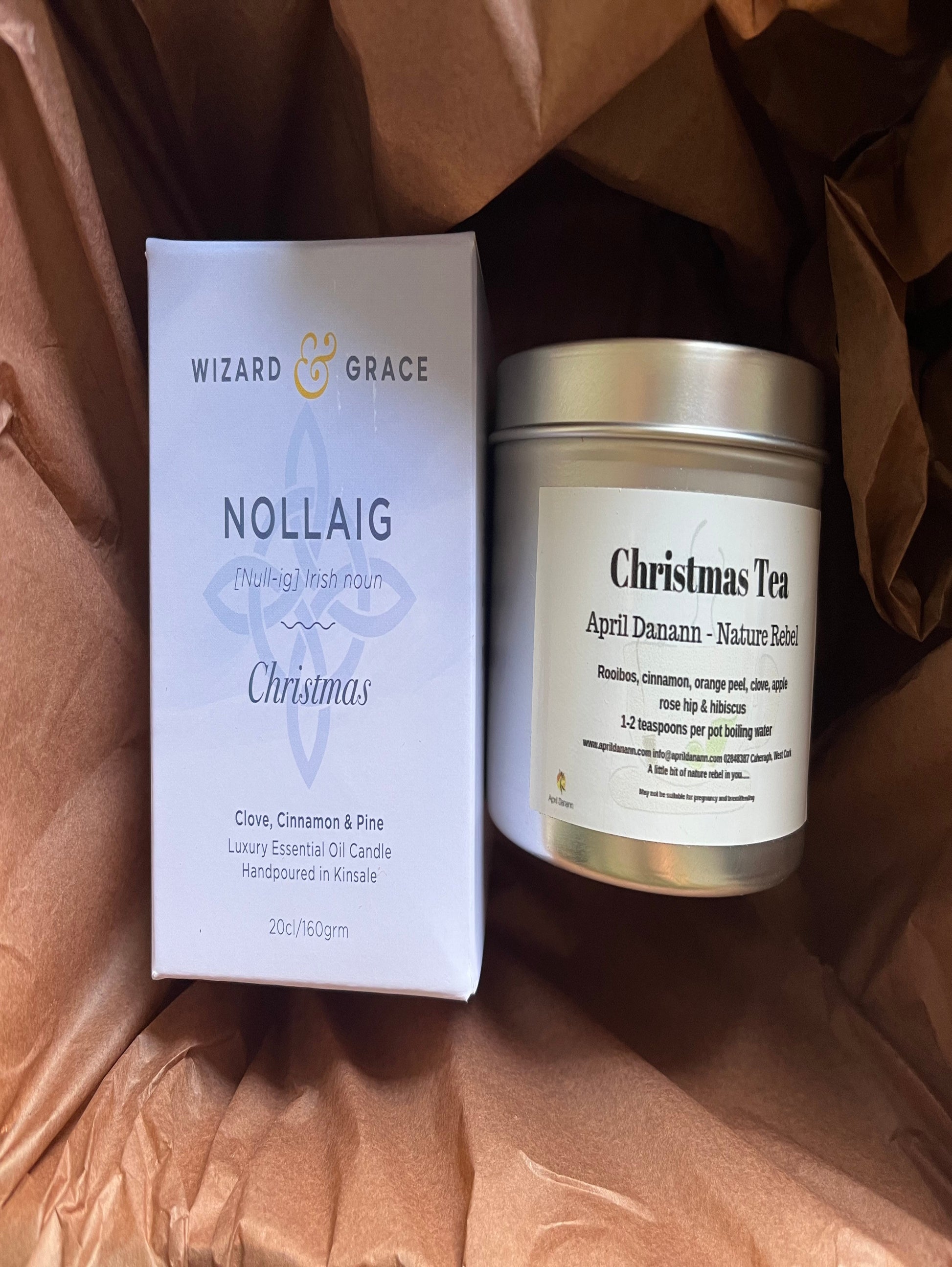 Candle and packaging with 'Wizard & Grace' branding on a brown textured background