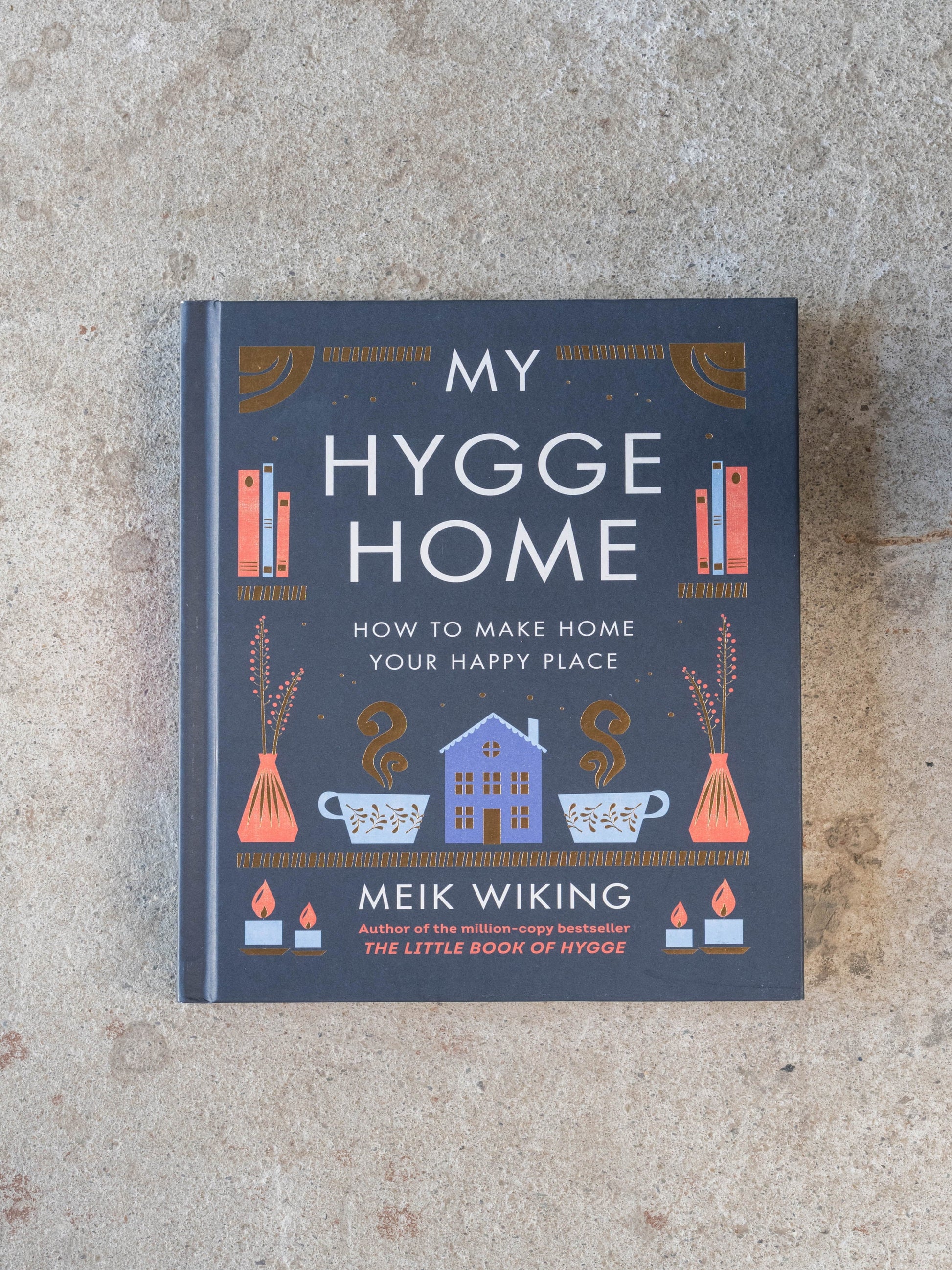 Book titled 'My Hygge Home' by Meik Wiking on a textured surface