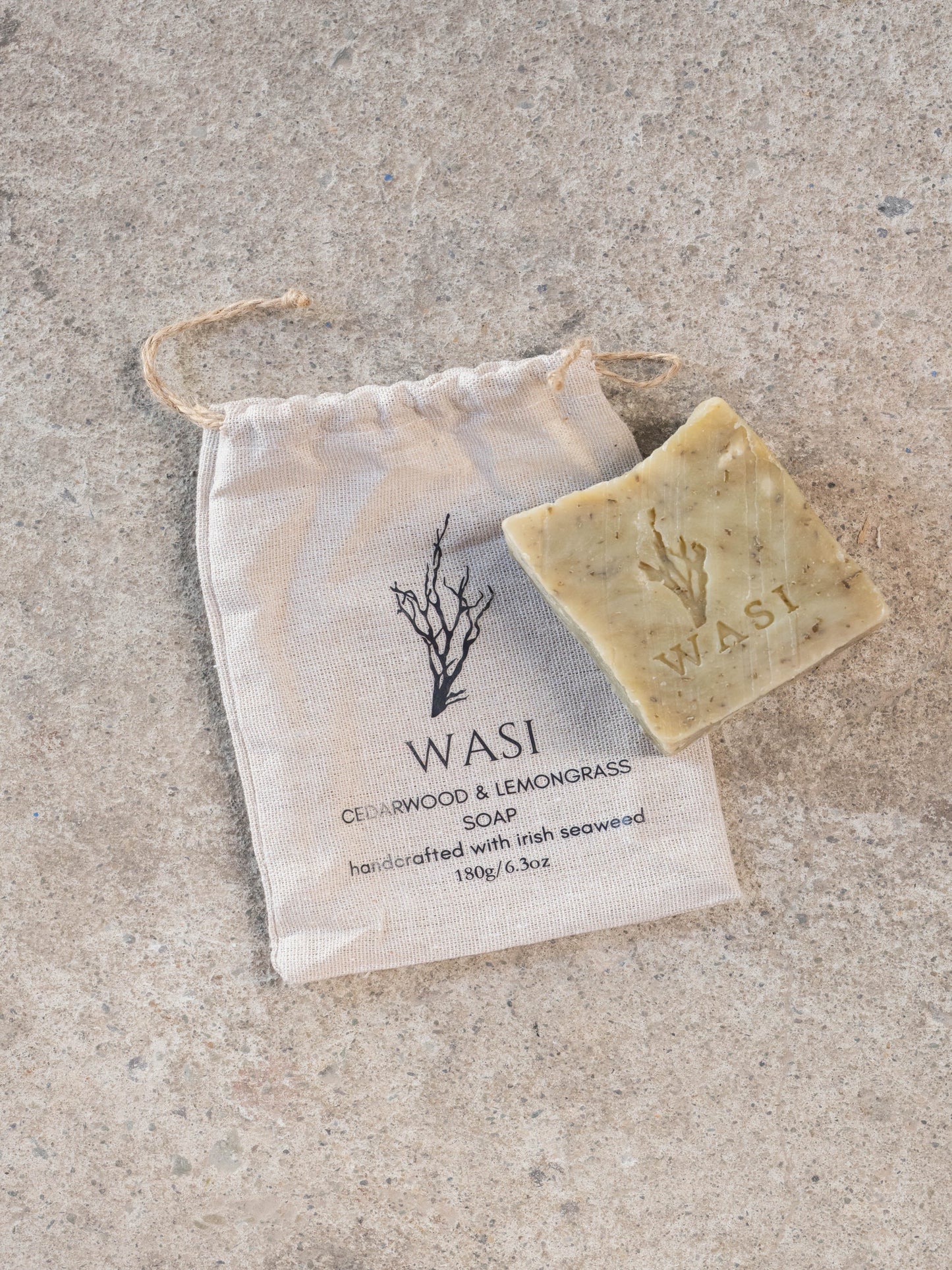 Bar of soap with 'WASI' branding on a textured surface. 180g.