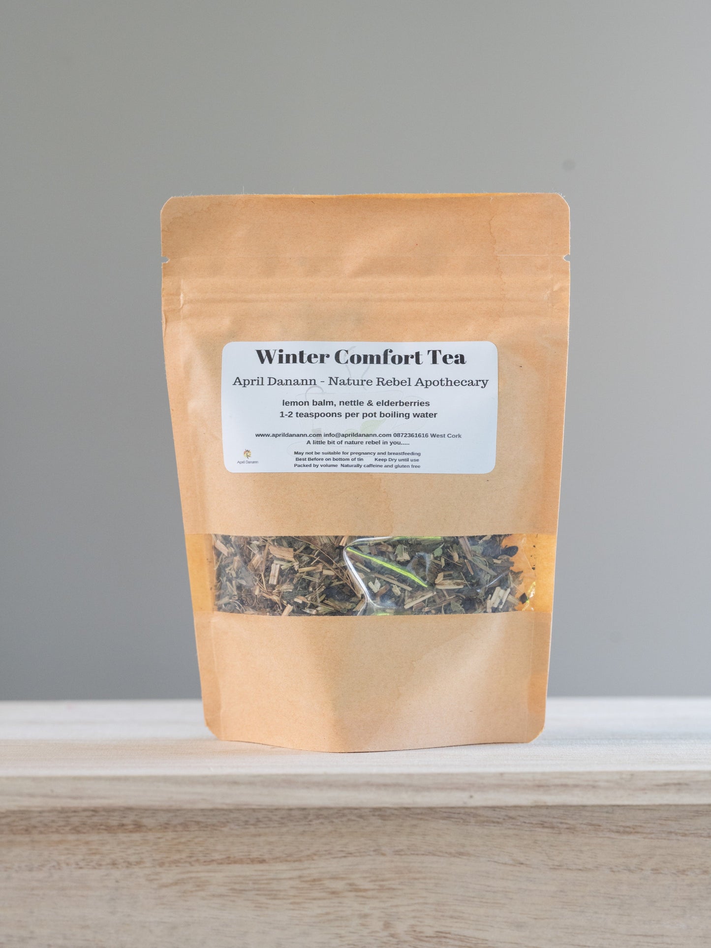 a picture of a brown bag of tea with winter comfort tea label.