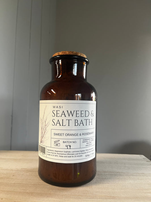 Brown bottle with a label on a wooden surface