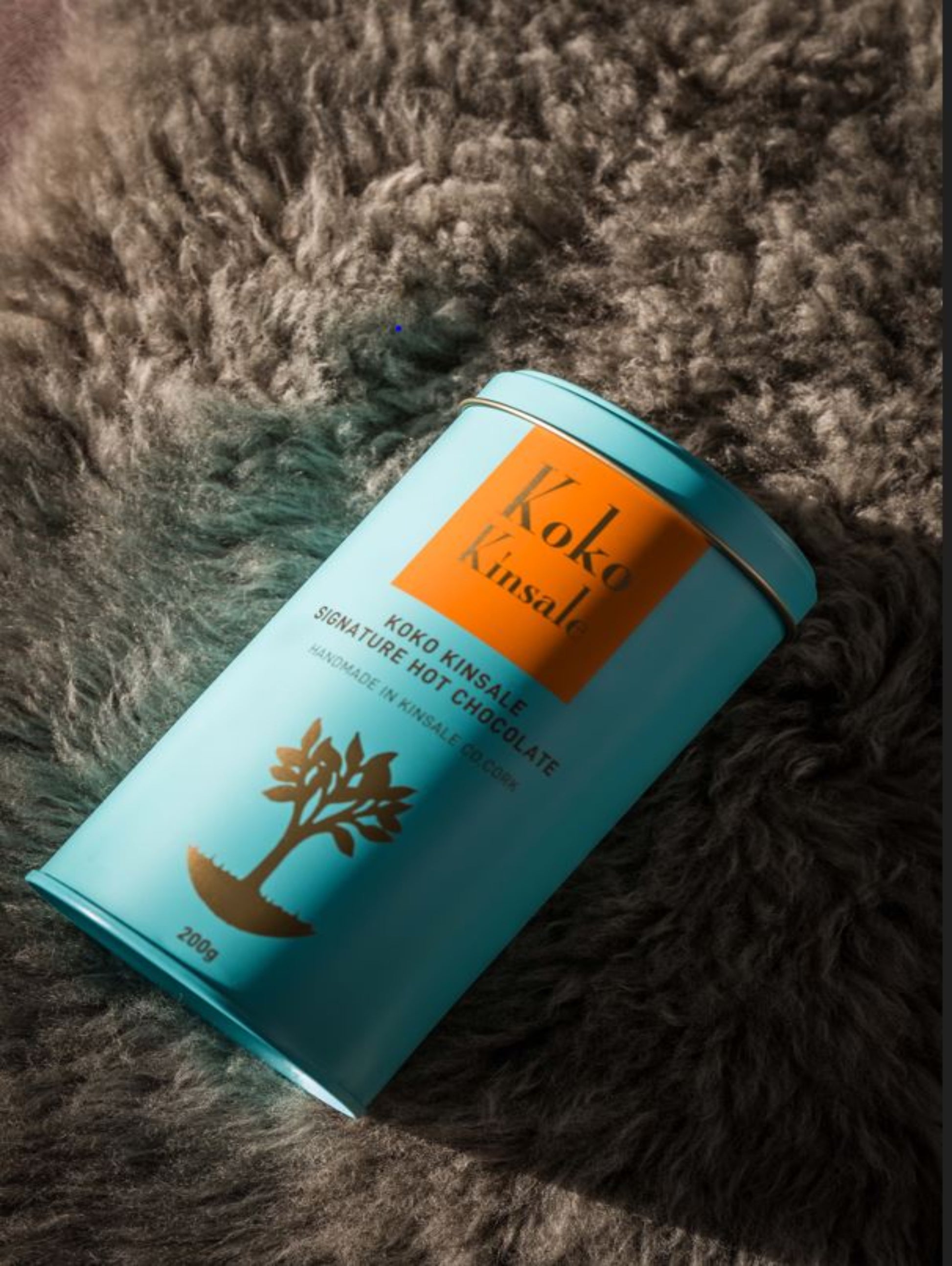 This is a picture of a blue tin with an orange label that says Koko Kinsale, signature hot chocolate 200g.
