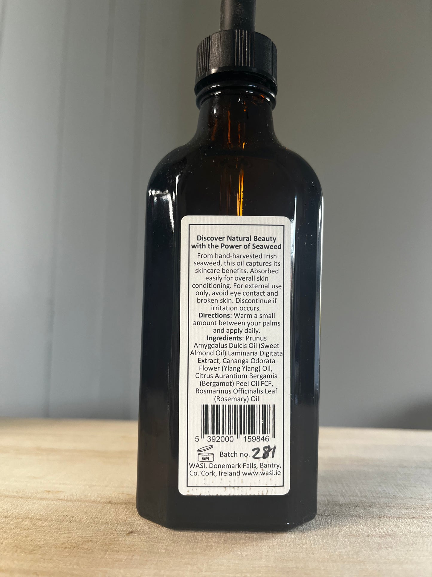 Bottle with a label on a neutral background